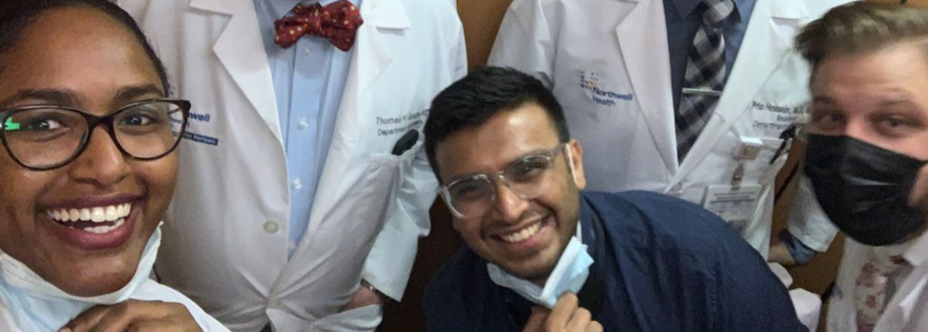 Dr. Shah smiling with colleagues