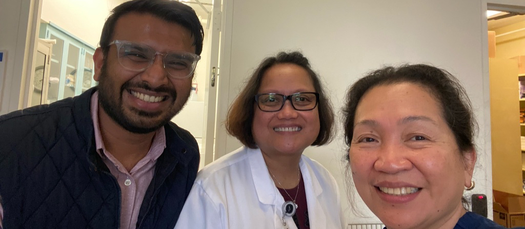 Dr. Shah smiling with two nursing colleagues